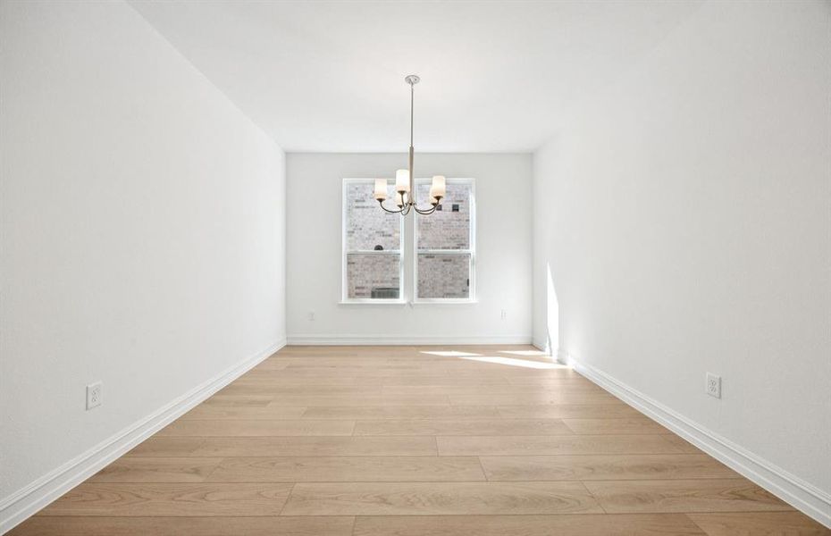 Formal dining room with large windows