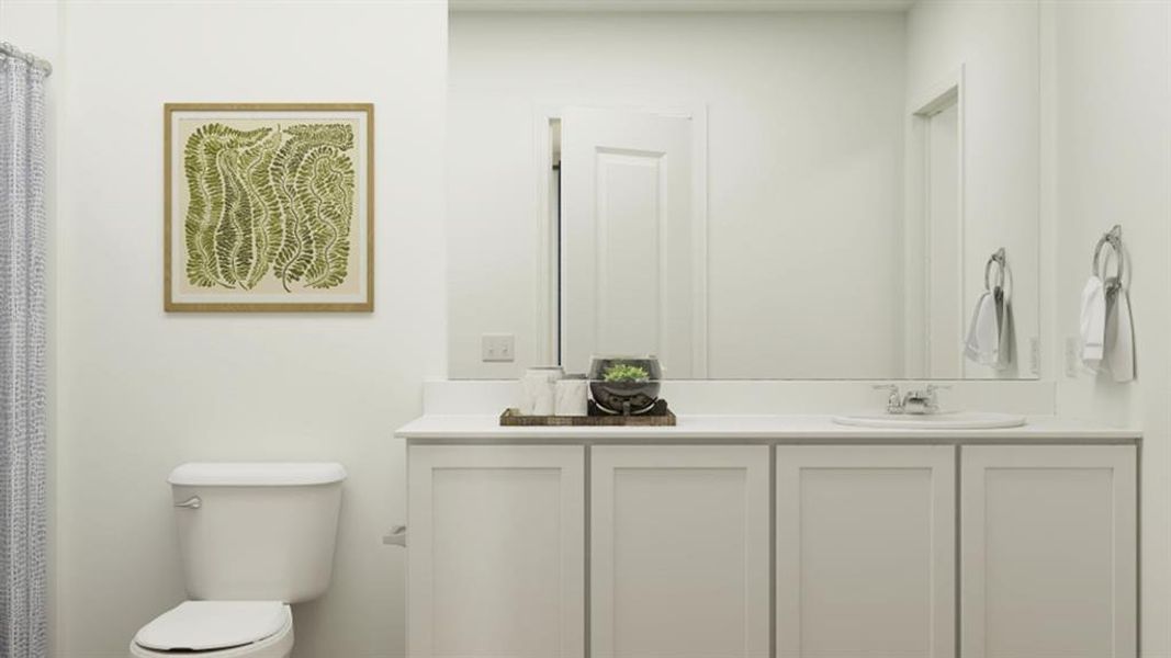 Bathroom featuring toilet and vanity