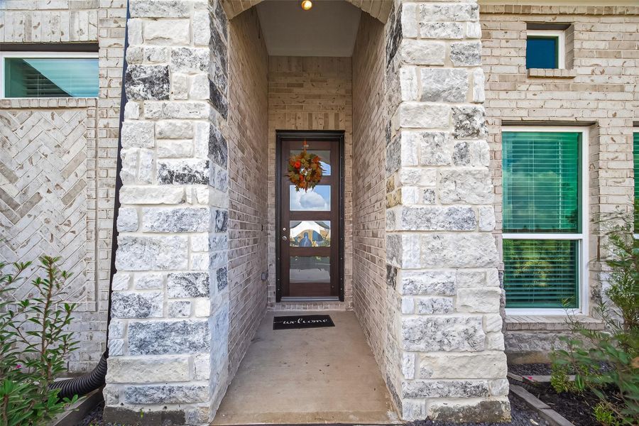 Exterior details and patio area of a home in Rates starting as low as, Iowa Colony (Image 3).