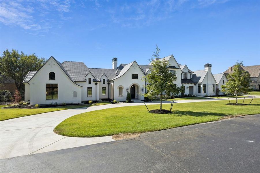 Front exterior of a new home in , Westlake, TX, highlighting curb appeal (Image 26). Front exterior of a new home in , Westlake, TX, highlighting curb appeal (Image 26).