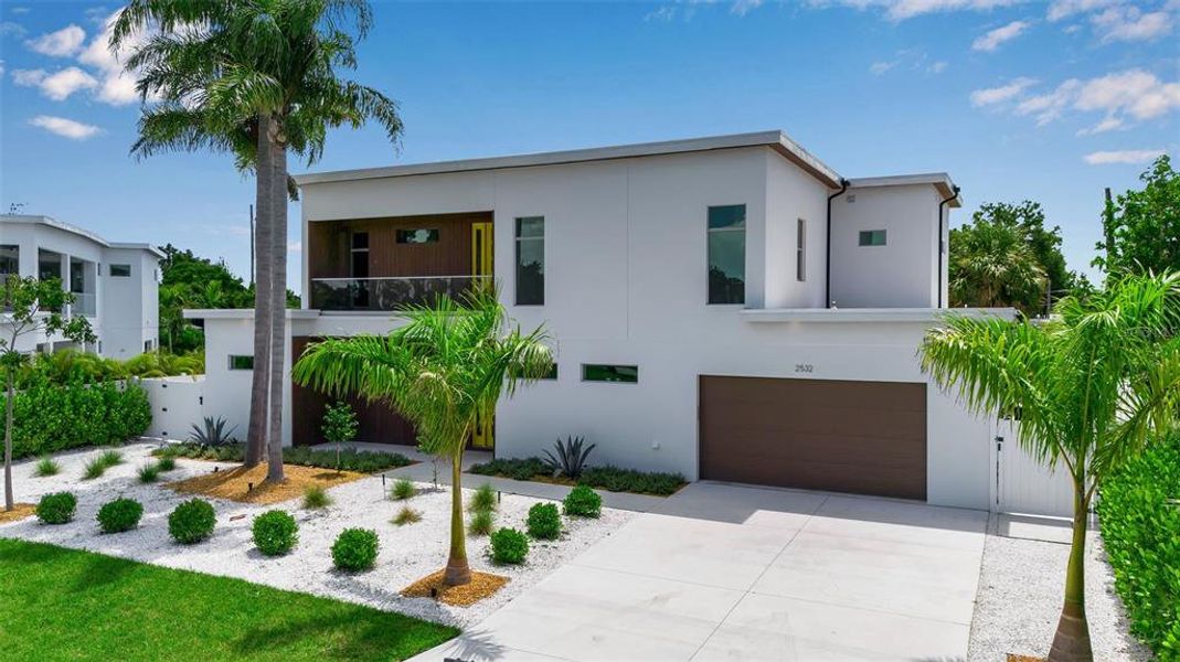 Front exterior of a new home in , Sarasota, FL, highlighting curb appeal (Image 2).