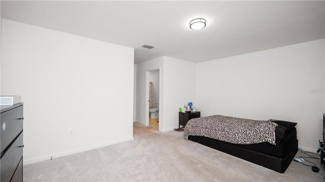 Furnished interior view inside a new home in Peace Creek Reserve: Legacy Collection, Winter Haven (Image 14).