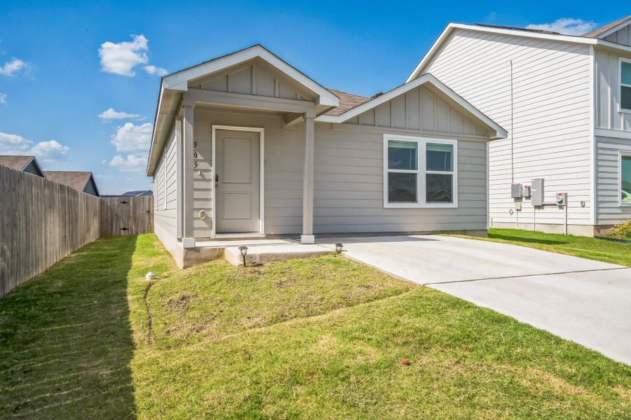 A welcoming facade with a small front porch and well-maintained lawn awaits. A welcoming facade with a small front porch and well-maintained lawn awaits.