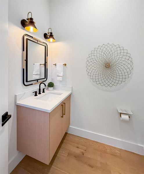 Bathroom featuring vanity and light wood-style floors Bathroom featuring vanity and light wood-style floors