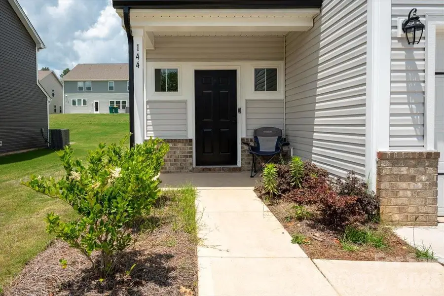 Exterior details and patio area of a home in , Oakboro (Image 30).