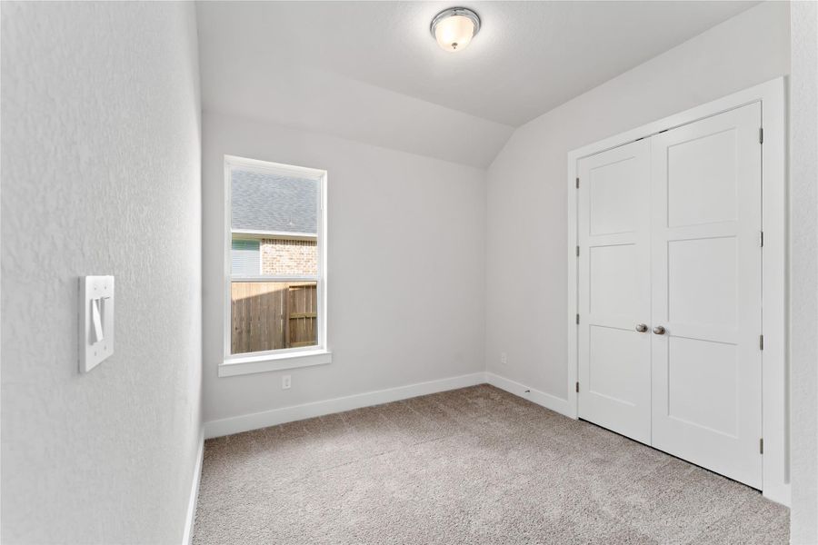 Spacious, unfurnished interior of a new home in Ellwood, Iowa Colony (Image 16).