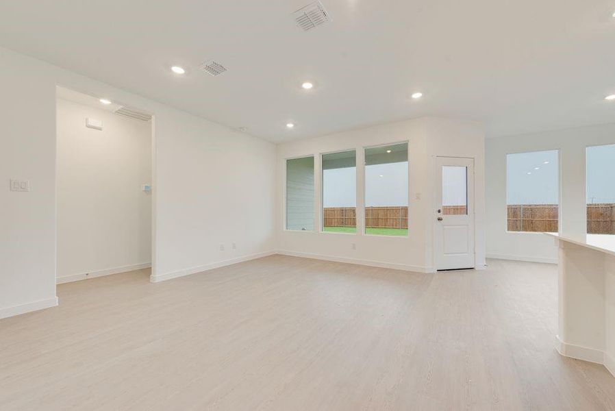Unfurnished room featuring light wood-style floors and recessed lighting Unfurnished room featuring light wood-style floors and recessed lighting