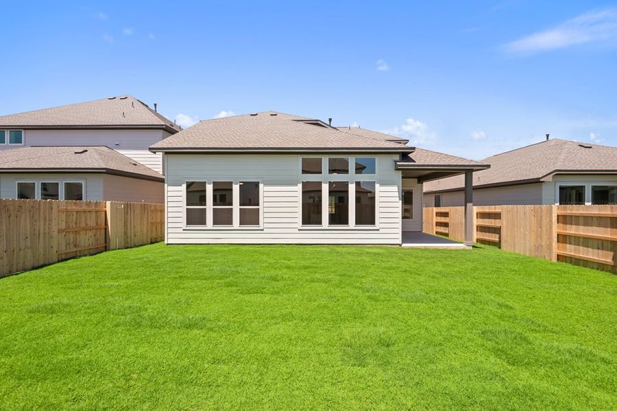 Front exterior of a new home in Lagos Reserve, Manor, TX, highlighting curb appeal (Image 24). Front exterior of a new home in Lagos Reserve, Manor, TX, highlighting curb appeal (Image 24).