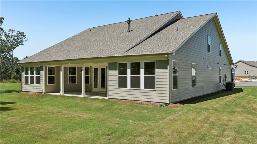 Exterior details and patio area of a home in Cresswind Georgia at Twin Lakes, Hoschton (Image 28).