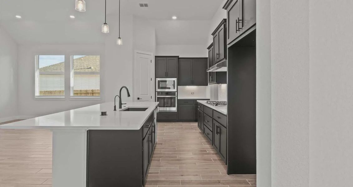 Representative furnished interior of a home built from the Summerton by Chesmar Homes in Village at Three Oaks, Seguin (Image 4).
