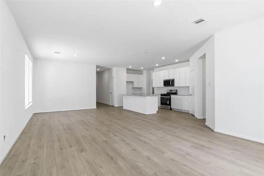 Stunning open-concept design seamlessly connecting the living, dining, and kitchen areas—perfect for both everyday living and entertaining! Stunning open-concept design seamlessly connecting the living, dining, and kitchen areas—perfect for both everyday living and entertaining!