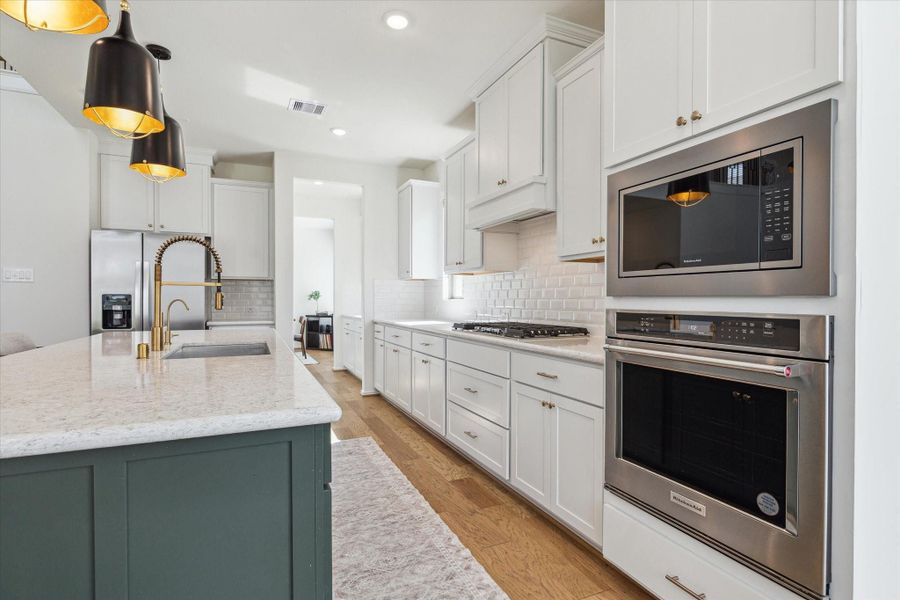 Functional kitchen layout featuring specialized drawers for pots and pans, keeping everything neatly organized.