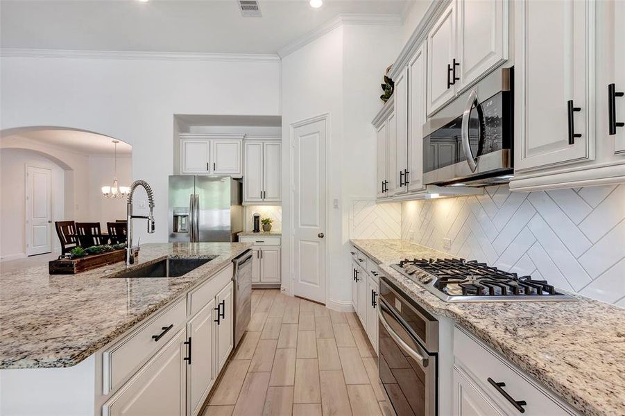 Gas cooktop is always a cook's favorite. Granite countertops. Big farm sink.