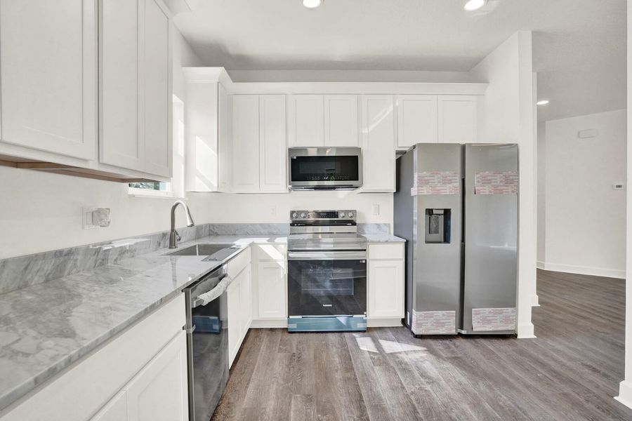 Furnished interior view inside a new home in , Lantana (Image 6).
