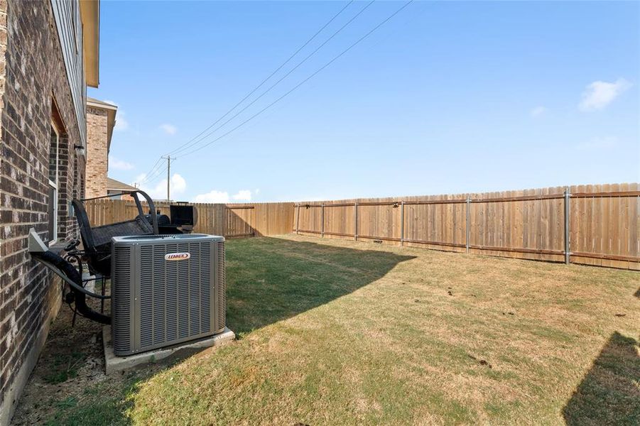 View of fenced backyard