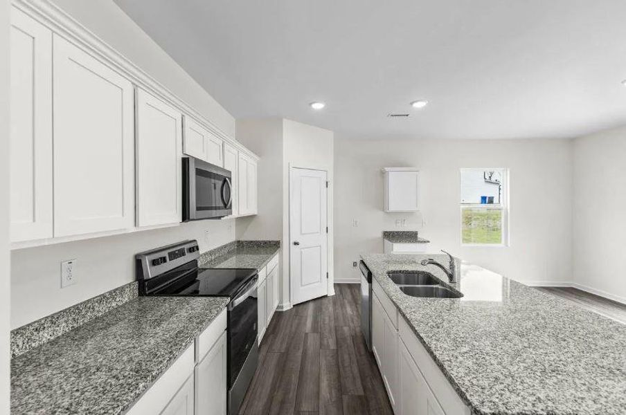 Granite countertops and Stainless Steel features - Representative Photo