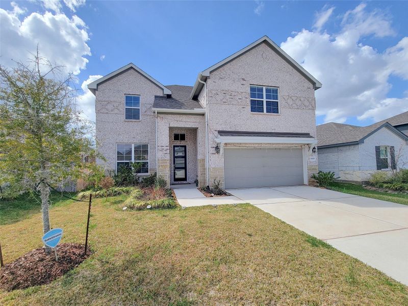Front exterior of a new home in Creekside Farms, Richmond, TX, highlighting curb appeal (Image 25).