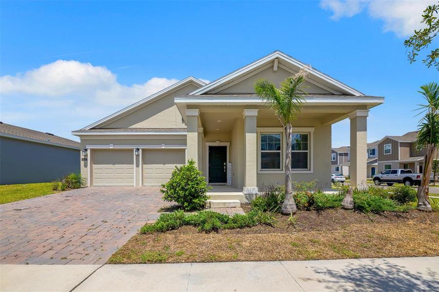Front exterior of a new home in Tohoqua, Kissimmee, FL, highlighting curb appeal (Image 22). Front exterior of a new home in Tohoqua, Kissimmee, FL, highlighting curb appeal (Image 22).
