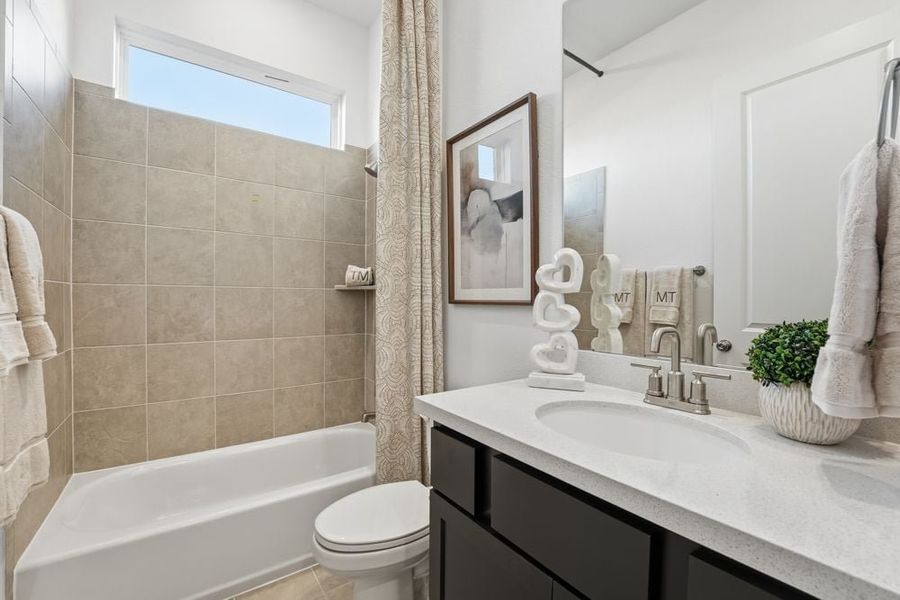 Representative furnished interior of a home built from the Burnet by Taylor Morrison in Village Grove, Dripping Springs (Image 15).