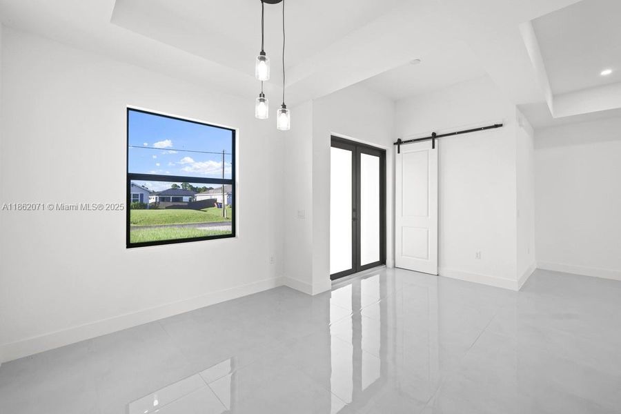 ENTRANCE AND BARN DOORS INTO LAUNDRY & GARAGE