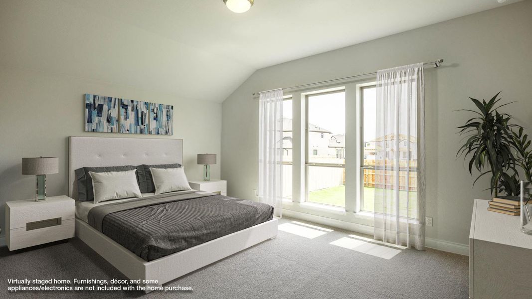 Carpeted bedroom with multiple windows, baseboards, and lofted ceiling Carpeted bedroom with multiple windows, baseboards, and lofted ceiling