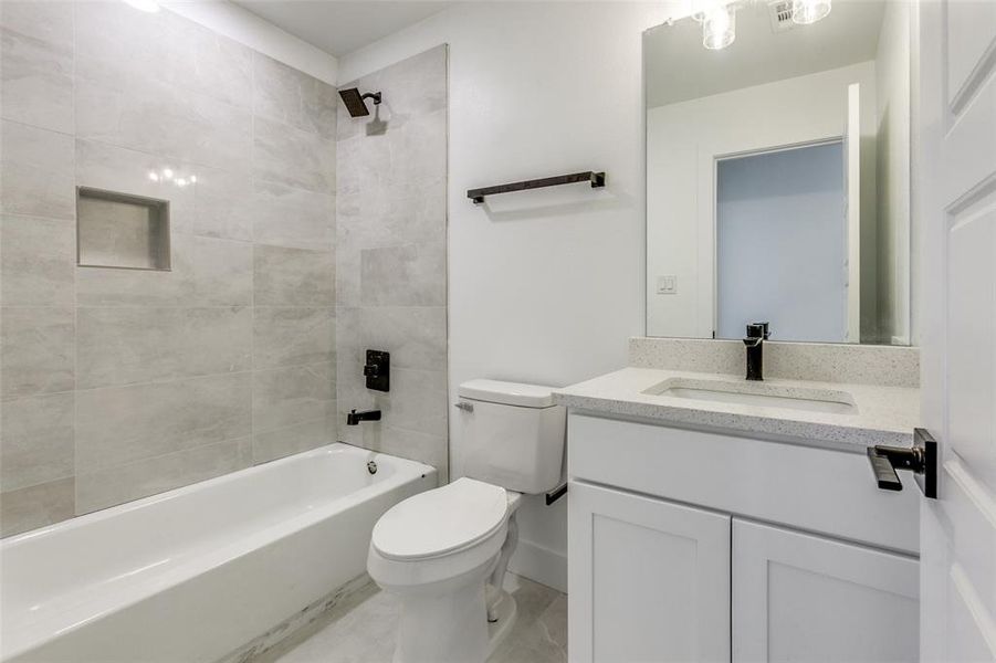 Bathroom with shower / bathtub combination and vanity