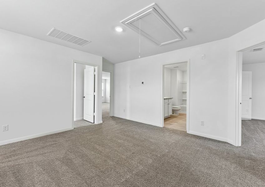 Upstairs landing featuring carpet flooring and a sightline toward the secondary bedrooms.