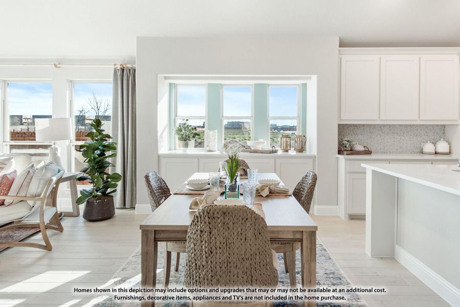 Open dining area with wood table, wicker chairs, and large windows, adjacent to white kitchen cabinets Open dining area with wood table, wicker chairs, and large windows, adjacent to white kitchen cabinets
