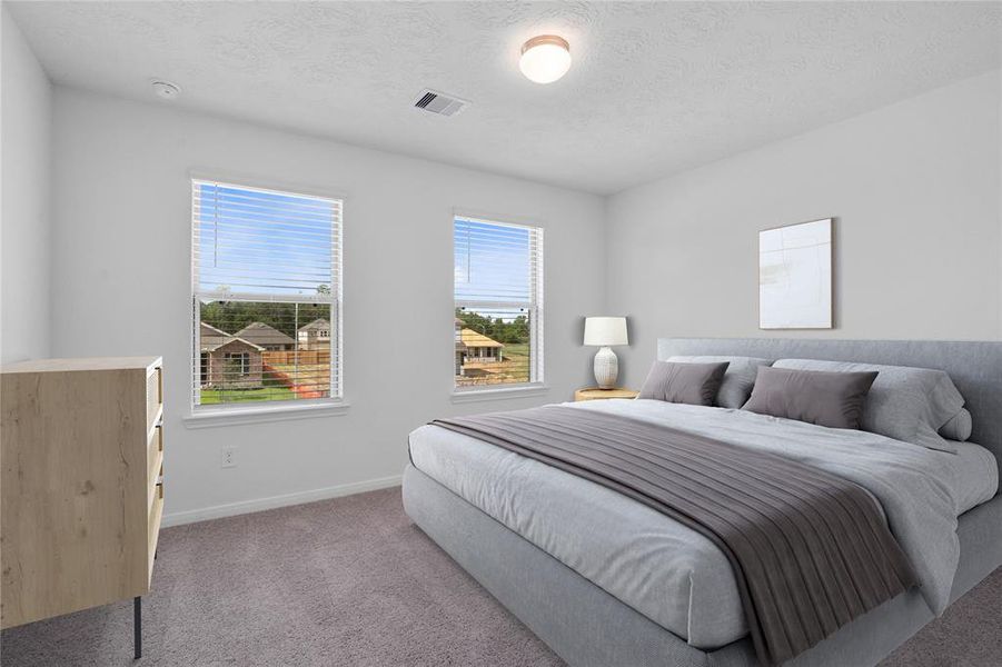 Secondary bedroom features plush carpet, neutral paint, lighting, large window with privacy blinds and ample sized closet space.