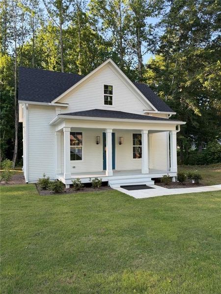 Front exterior of a new home in , Bowdon, GA, highlighting curb appeal (Image 21).