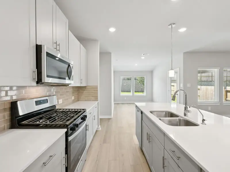 Furnished interior view inside a new home in Sanford Farms - Premier Series, Waller (Image 6).