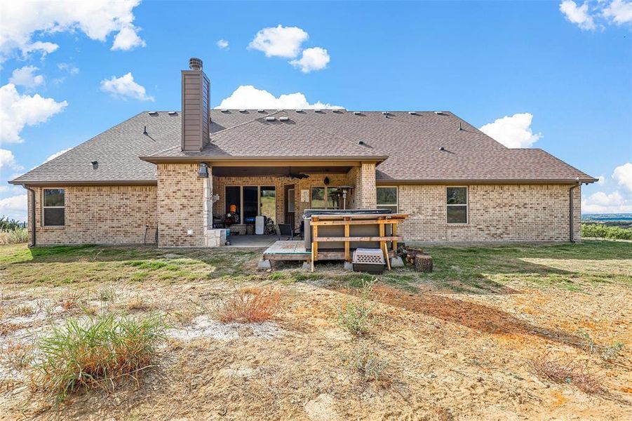 Back of property with a patio area