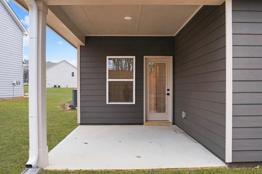 Exterior details and patio area of a home in The Fairways at Mirror Lake, Villa Rica (Image 4).