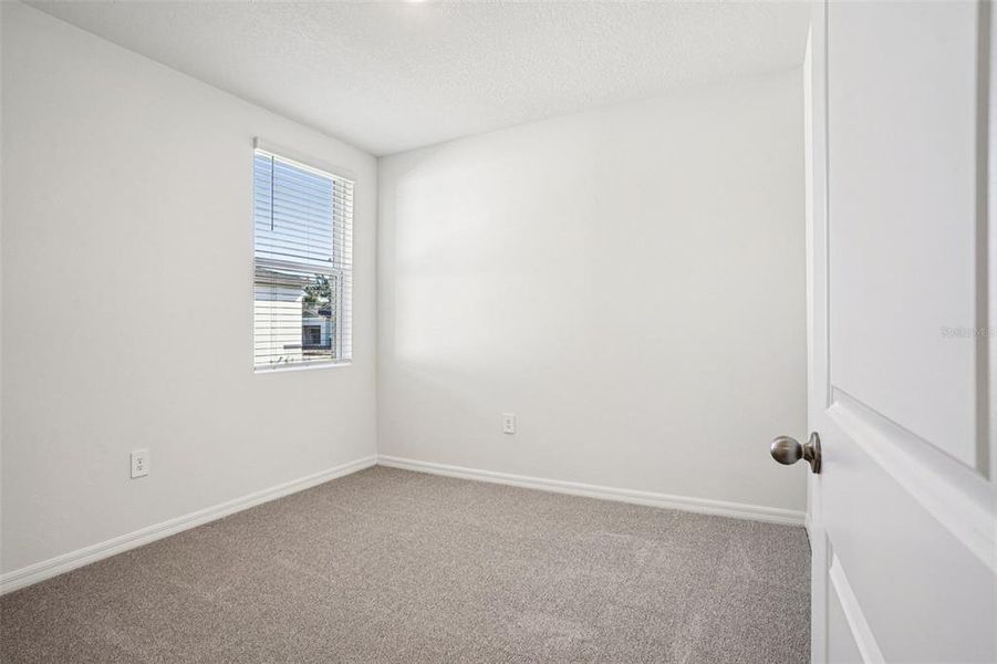 Spacious, unfurnished interior of a new home in Ridgehaven - Villas, Ormond Beach (Image 31).