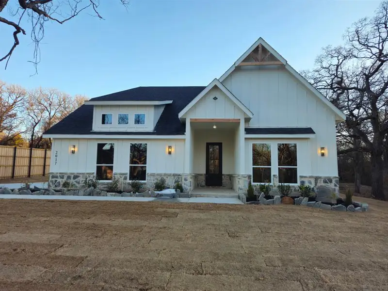 Front exterior of a new home in , Azle, TX, highlighting curb appeal (Image 2). Front exterior of a new home in , Azle, TX, highlighting curb appeal (Image 2).