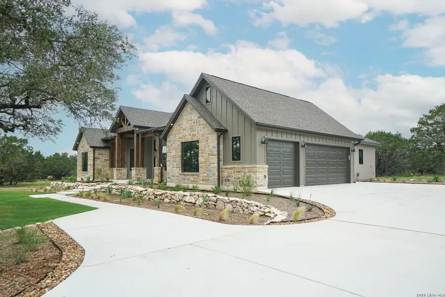 Front exterior of a new home in , Spring Branch, TX, highlighting curb appeal (Image 2). Front exterior of a new home in , Spring Branch, TX, highlighting curb appeal (Image 2).