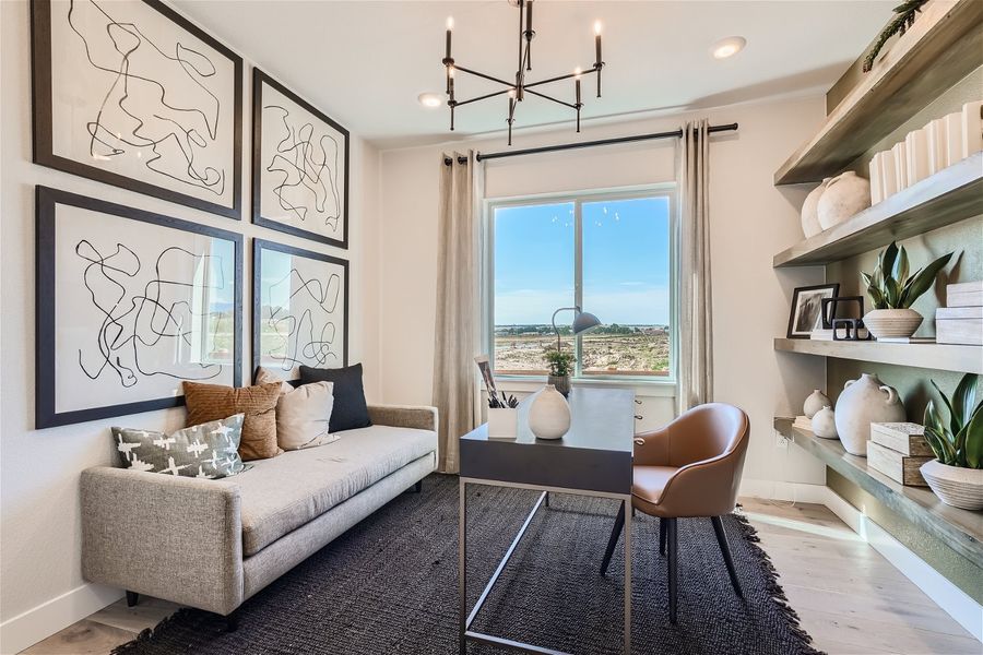 A living room with a couch and a table. A living room with a couch and a table.