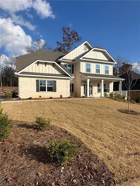 Front exterior of a new home in Mirror Lake at South Harbour, Villa Rica, GA, highlighting curb appeal (Image 2).