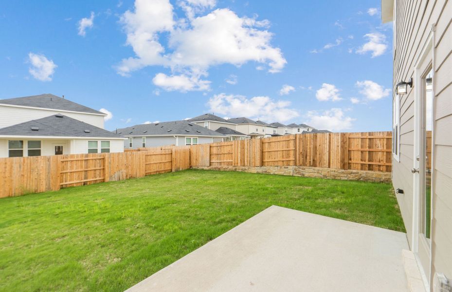 Exterior details and patio area of a home in Sunfield, Buda (Image 21).