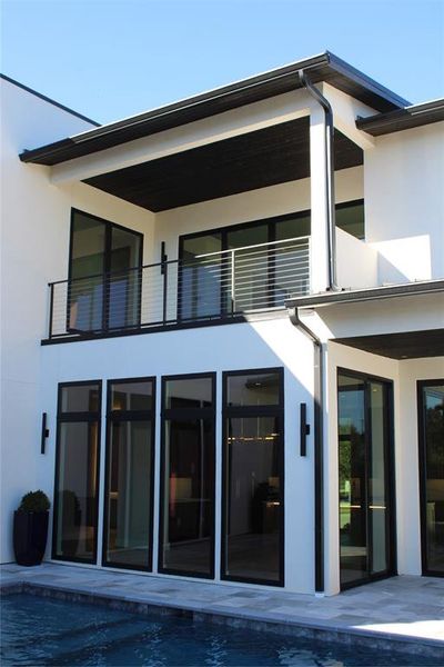 Rear view of property featuring a balcony