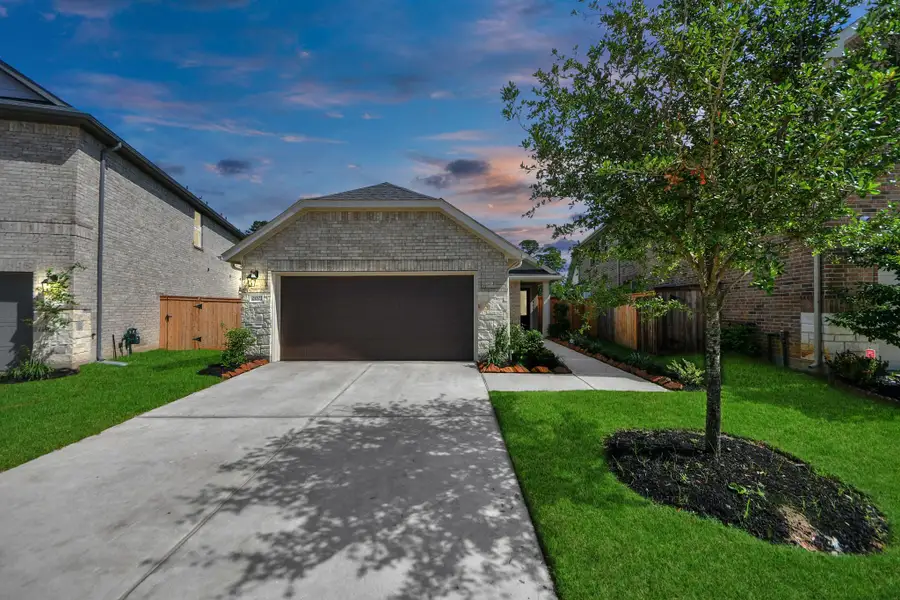 Front exterior of a new home in , Tomball, TX, highlighting curb appeal (Image 2).