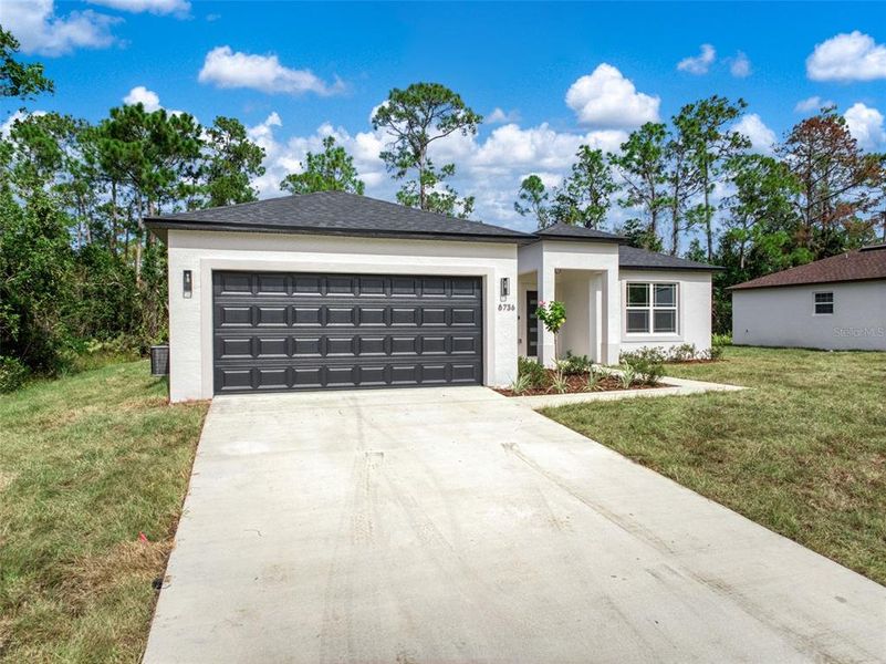 Front exterior of a new home in , Sebring, FL, highlighting curb appeal (Image 2).