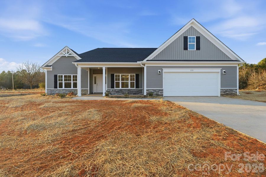 Front exterior of a new home in , Troutman, NC, highlighting curb appeal (Image 2).