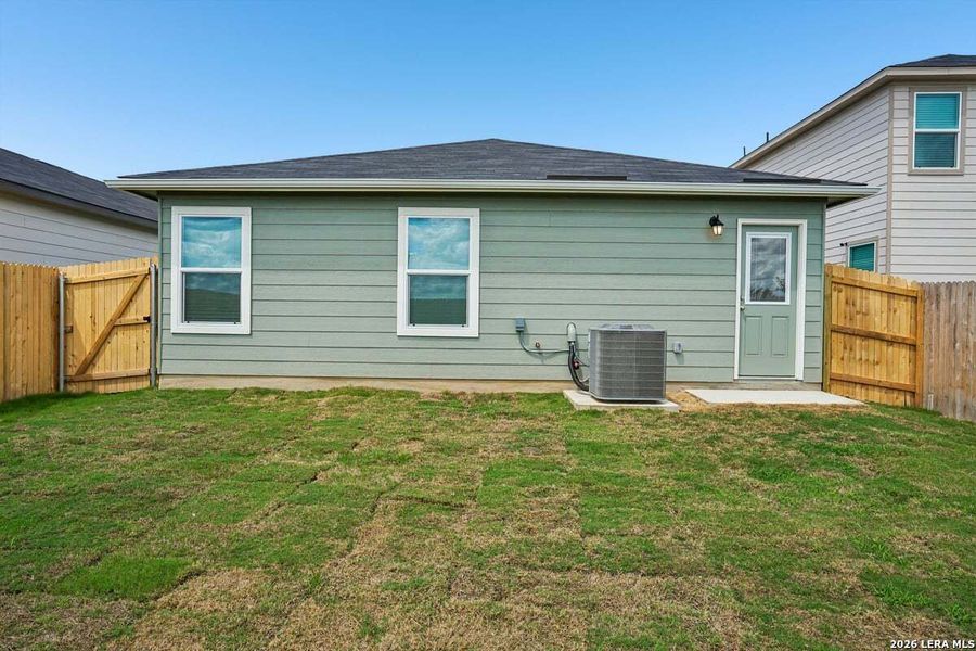 Exterior details and patio area of a home in Southton Cove, Elmendorf (Image 17).
