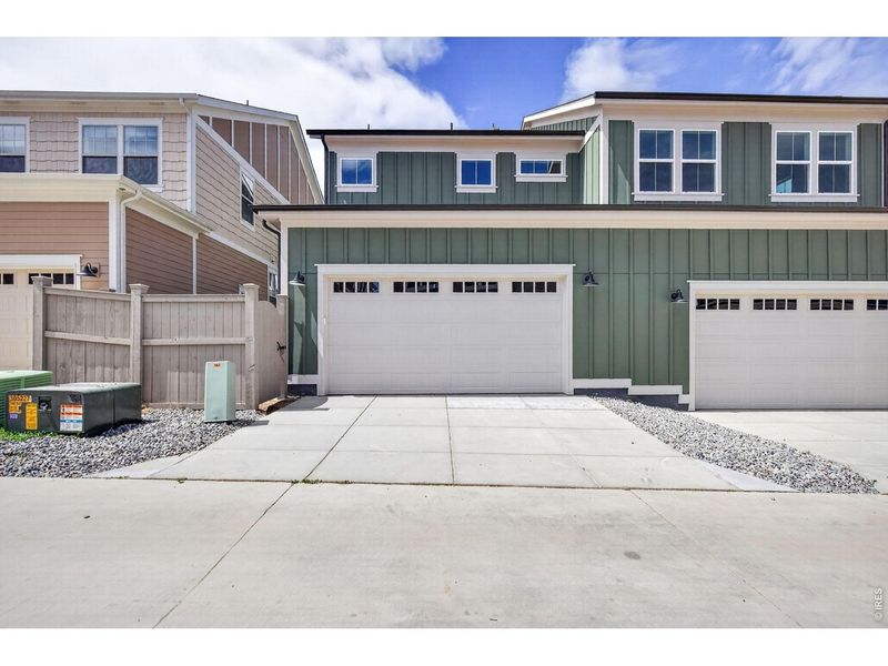 Front exterior of a new home in , Erie, CO, highlighting curb appeal (Image 14).