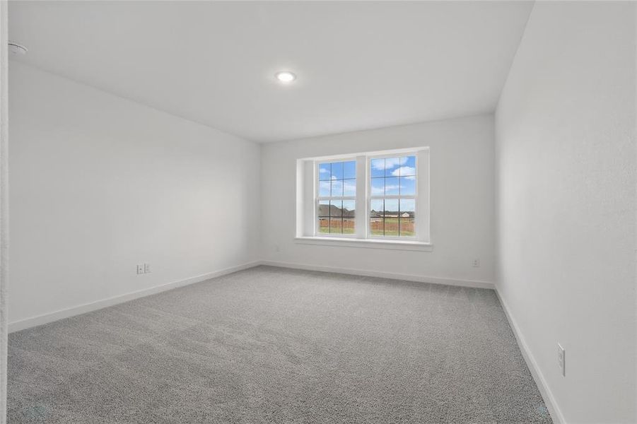 Spare room with light colored carpet