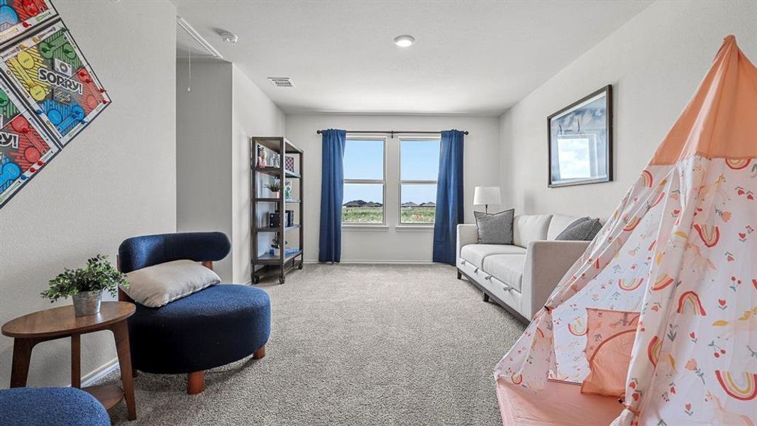 Living area with carpet floors and baseboards