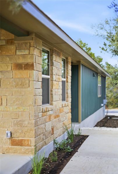 View of home's exterior with stone siding