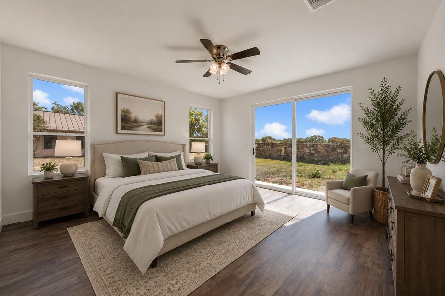 Virtually staged; sliding glass doors open this bedroom to the outdoors, showcasing durable wood-look flooring.