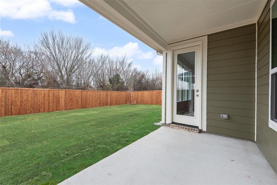 Exterior details and patio area of a home in Creekside of Crowley, Crowley (Image 23).